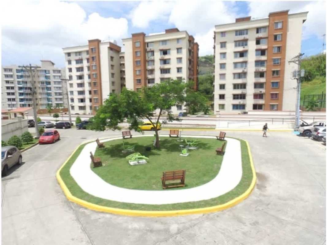 Bedroom setup with home office desk mirror and orange wall in PH Mallorca Park Village Panama