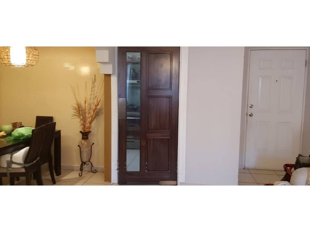 Dining area and entry of apartment with minimalist decor in PH Mallorca Park Village Panama