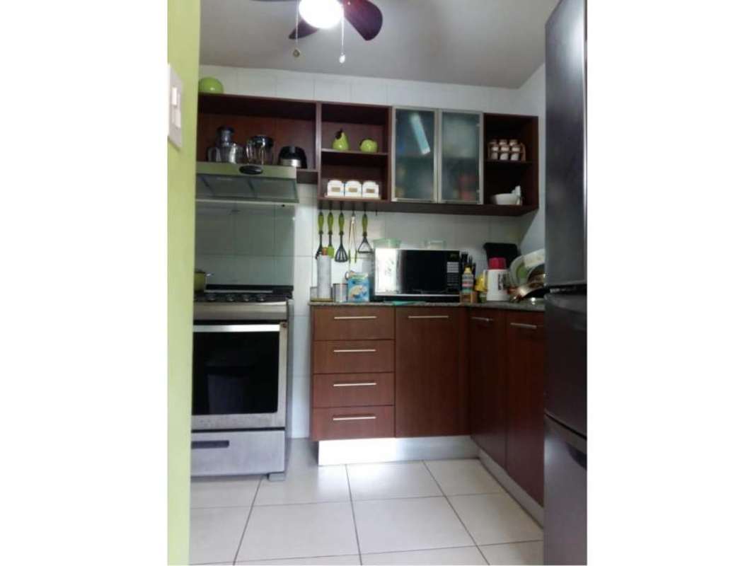 Contemporary remodeled kitchen with wooden cabinets and appliances PH Mallorca Park Village Panama City
