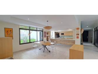 Remodeled interior with spacious dining, play space, decorative art in Nativa Panama Pacifico house