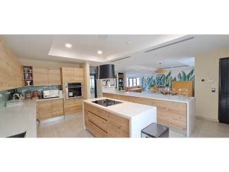 Master bedroom with walk-in closet, wood floors, AC and balcony in remodeled Nativa Panama Pacifico house