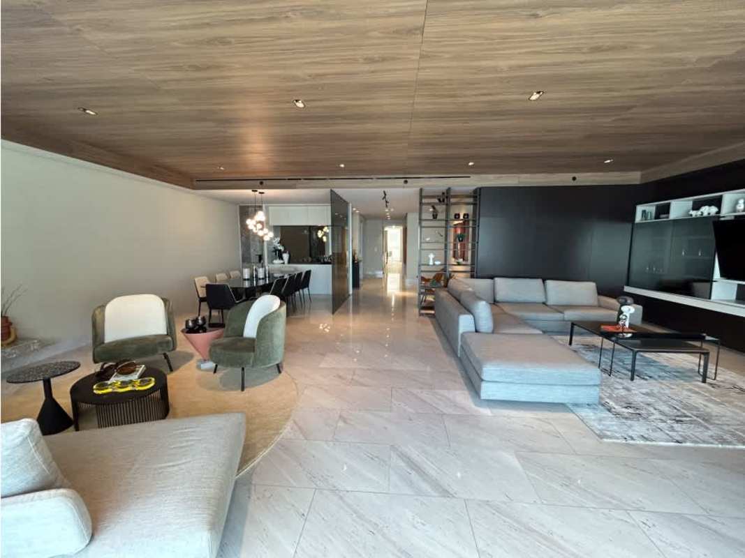 Modern dining space with floor-to-ceiling windows overlooking Pacific Ocean at The Towers Punta Paitilla