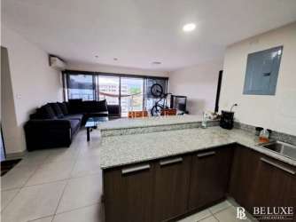 Furnished kitchen with granite counters, appliances in PH Woodlands Panama Pacifico