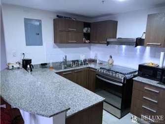 Bedroom with split AC, tile floors, view to mountain PH Woodlands Panama Pacifico