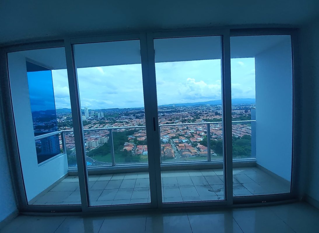 Spacious empty living-dining room with tiled floor, large windows in PH Top Tower Costa del Este Panama