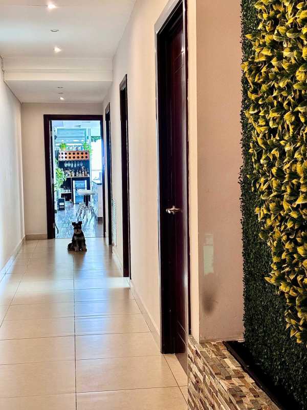 Comfortable secondary bedroom with built-in closets and city views at PH Rivage Panama City Panama