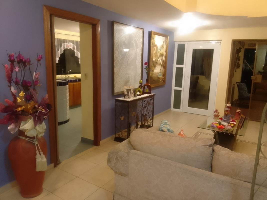 Hallway and living area with purple walls, decorative interior in Altos de Panama house