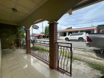Front porch area with archways and columns in La Ermita neighborhood house Las Tablas Panama