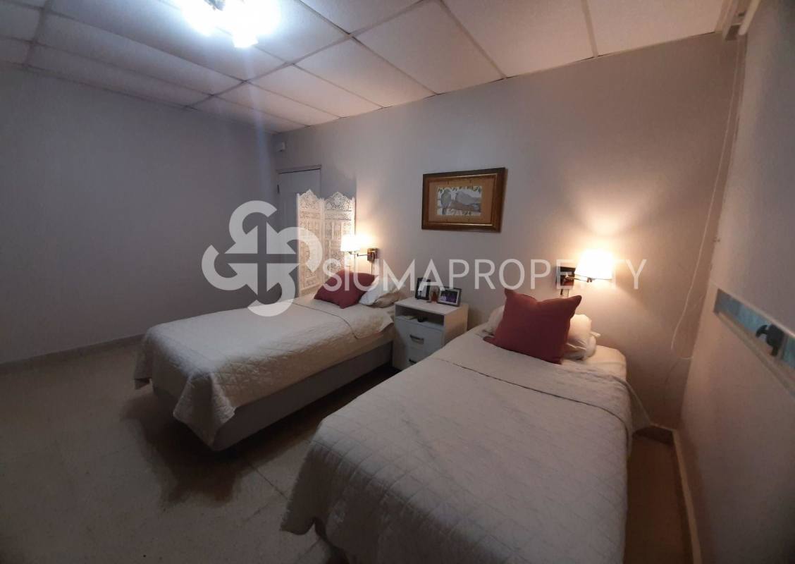 Main bedroom with closet and large window Villa Lilia San Francisco Panama