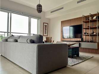 Modern open kitchen with appliances and sleek finishes in beachfront Laguna Buenaventura apartment Panama