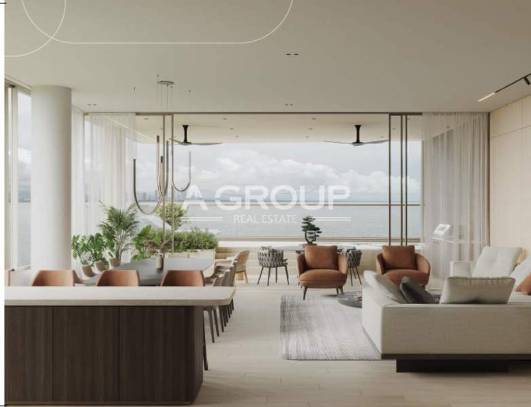 Modern living and dining area with floor-to-ceiling windows panoramic ocean view PH Aremar Panama