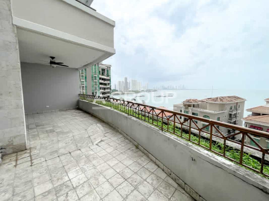 Formal dining area with marble floor and balcony with ocean views at Pacific Point Tower 600 Panama