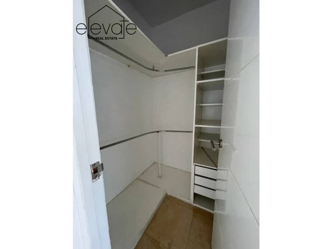 Modern kitchen with granite counters and stainless steel appliances in luxury apartment Costa del Este Panama