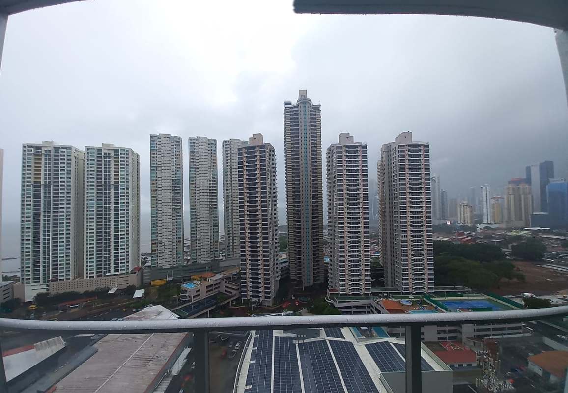 Balcony overlooking high-rise buildings and city skyline in San Francisco Panama from PH Water View