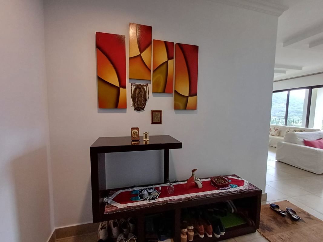 Dining room with bright decor and large windows in Amador Panama apartment