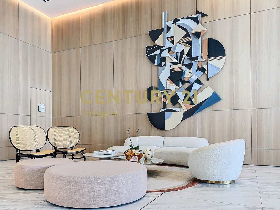 Designer lounge chairs, wood walls, marble floors in PH Pacific Point Tower 400 lobby Punta Pacífica Panama