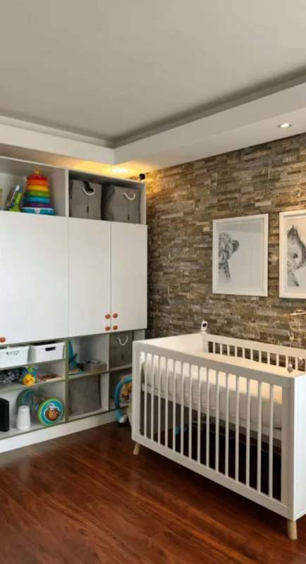 Kitchen with appliances, dark cabinetry, bright lighting in PH Ecco Tower apartment Panama City