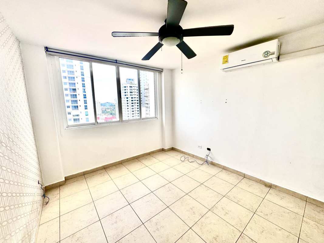 Second bedroom with window, ceiling fan, built-in closet tile floor PH Rim Tower Panama City