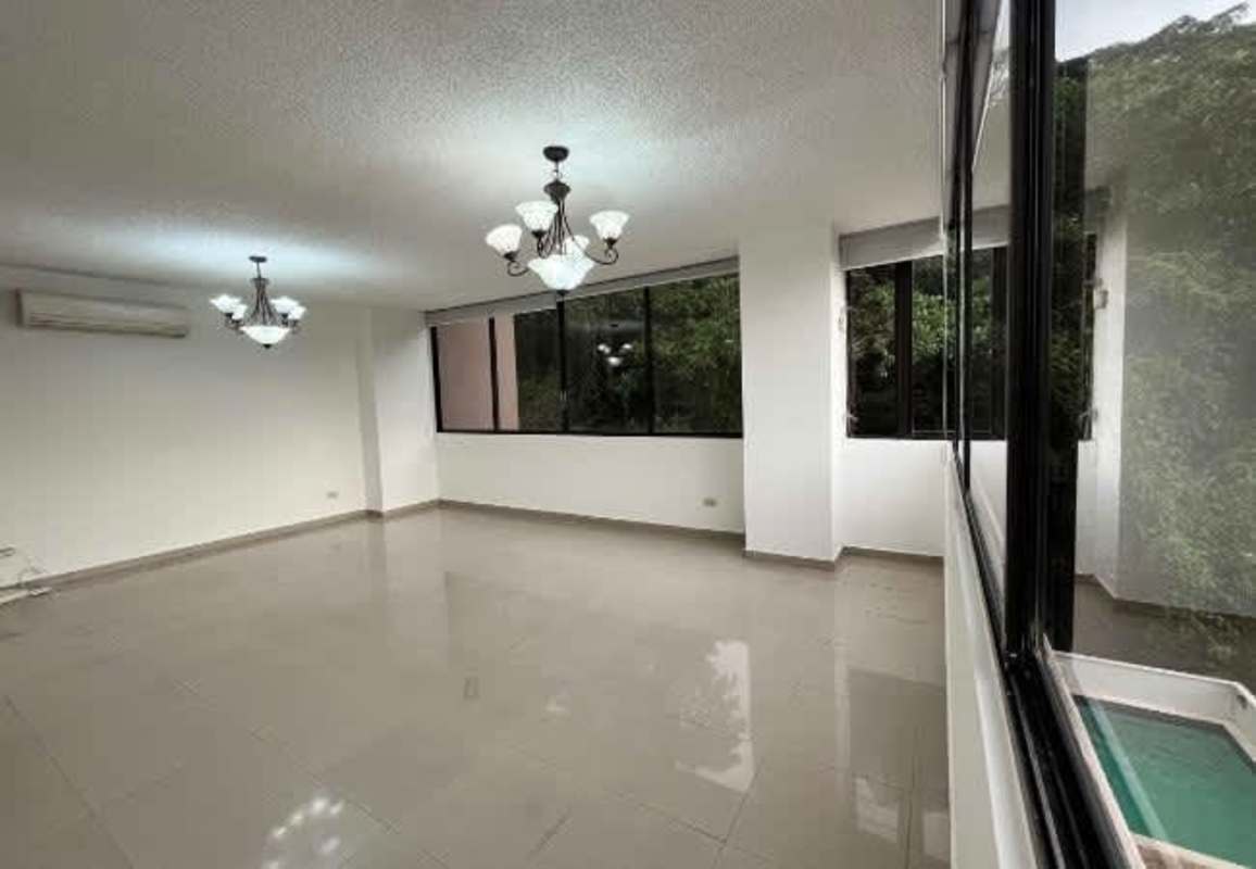 Bright empty living room with large windows at PH Metropolis Bella Vista Panama