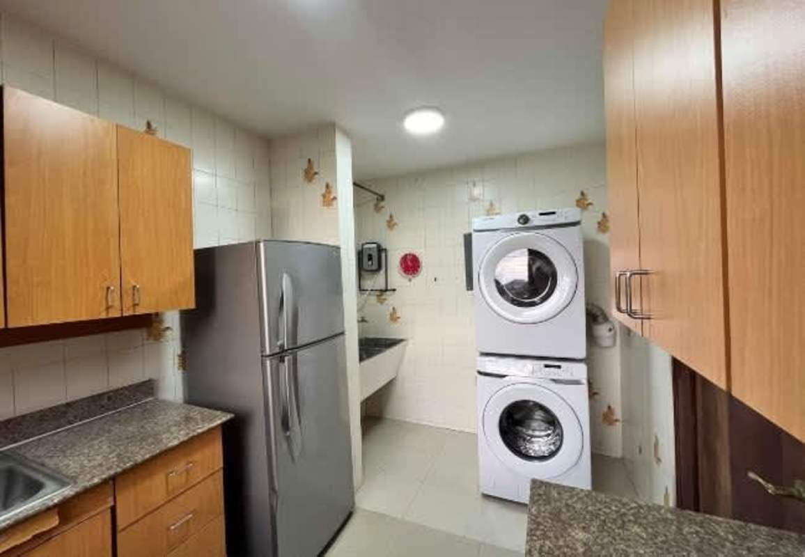 Laundry area with granite counter and appliances PH Metropolis Panama