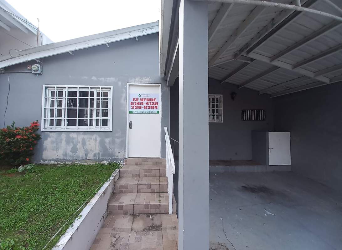 Bedroom with dark louvered closet doors and ceramic tile floor in Condado del Rey Panama City