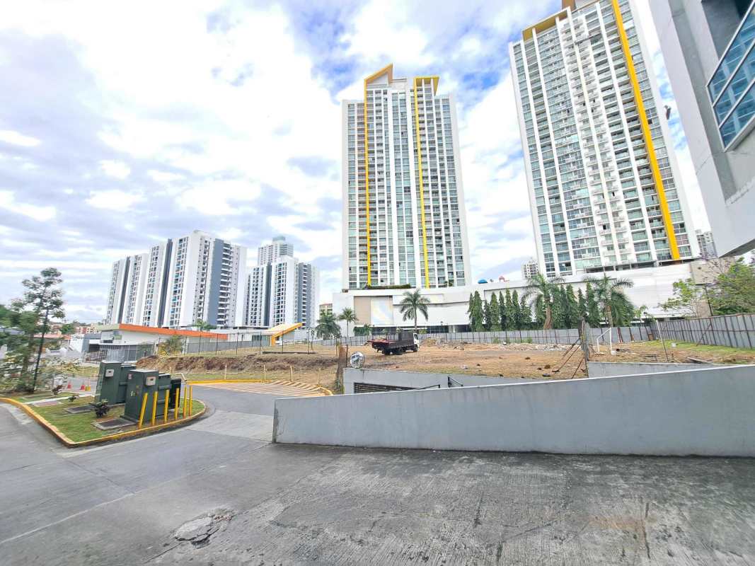 Colorful high-rise condos and street retail zone across from large corner lot for sale Panama
