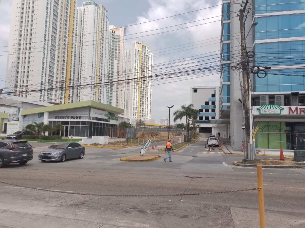 Modern colored high-rise condos and commercial space across from land Panama City