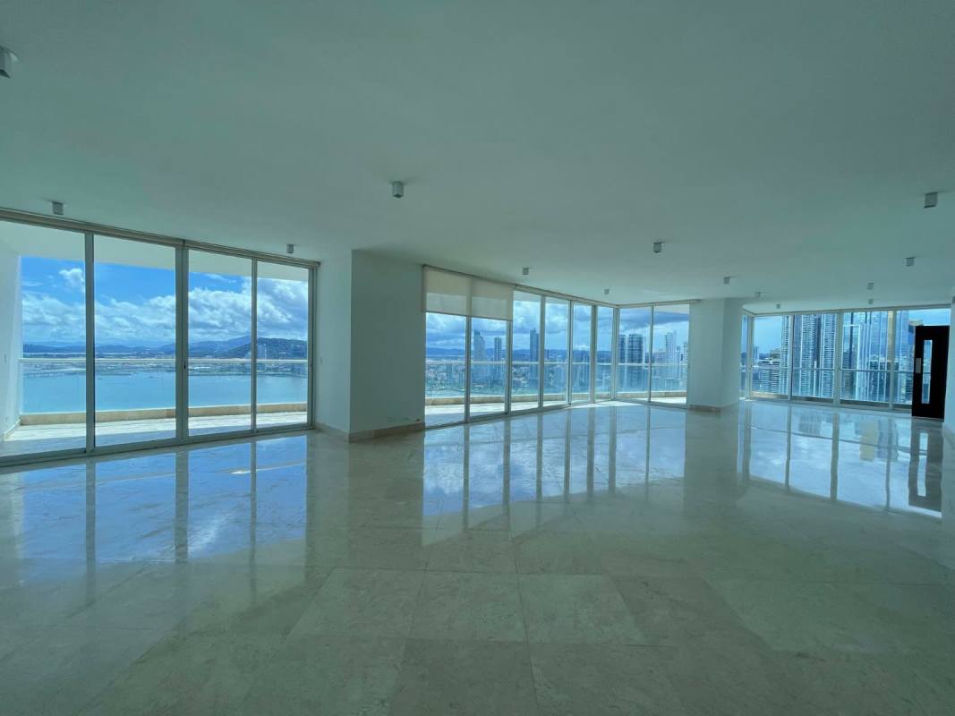 Spacious modern living room with marble floors, floor-to-ceiling windows panoramic ocean view in The Point Punta Paitilla Panama