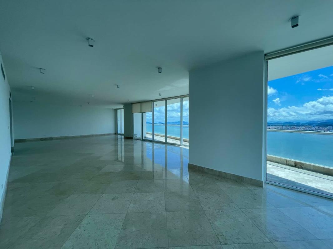 Spacious master bedroom with floor-to-ceiling oceanfront views marble floor The Point Punta Paitilla Panama