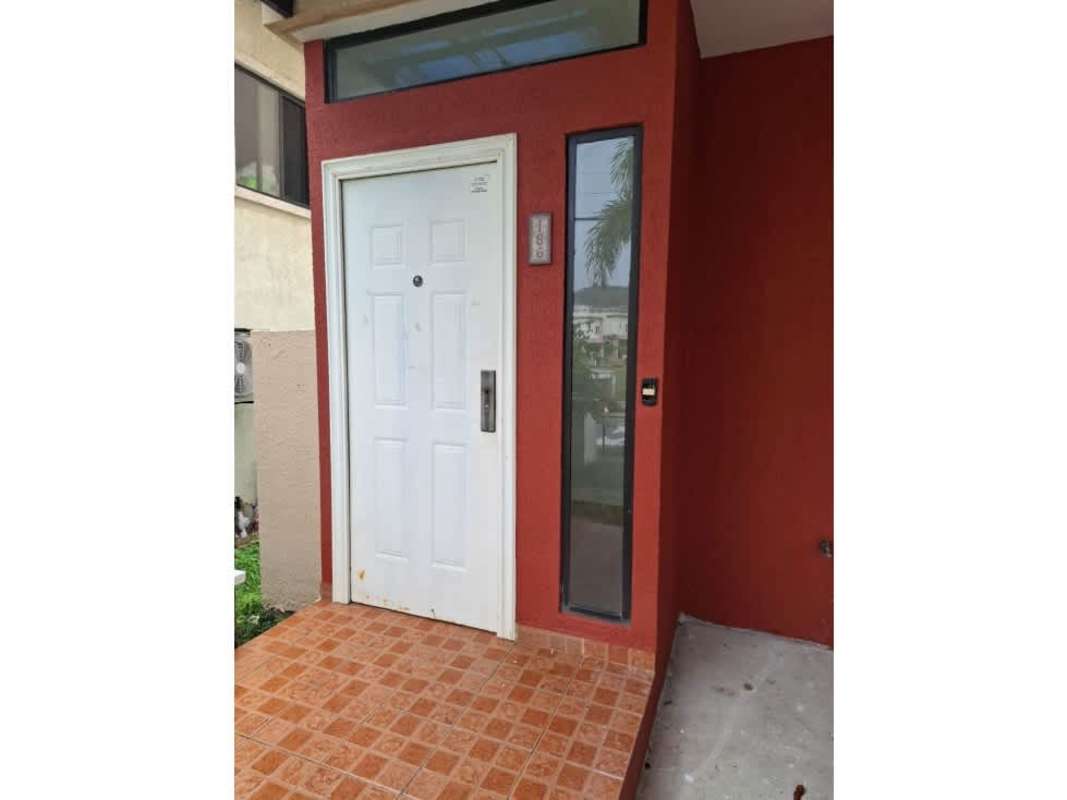 Spacious master bedroom with tiled floor and balcony access in Las Cumbres gated community Panama