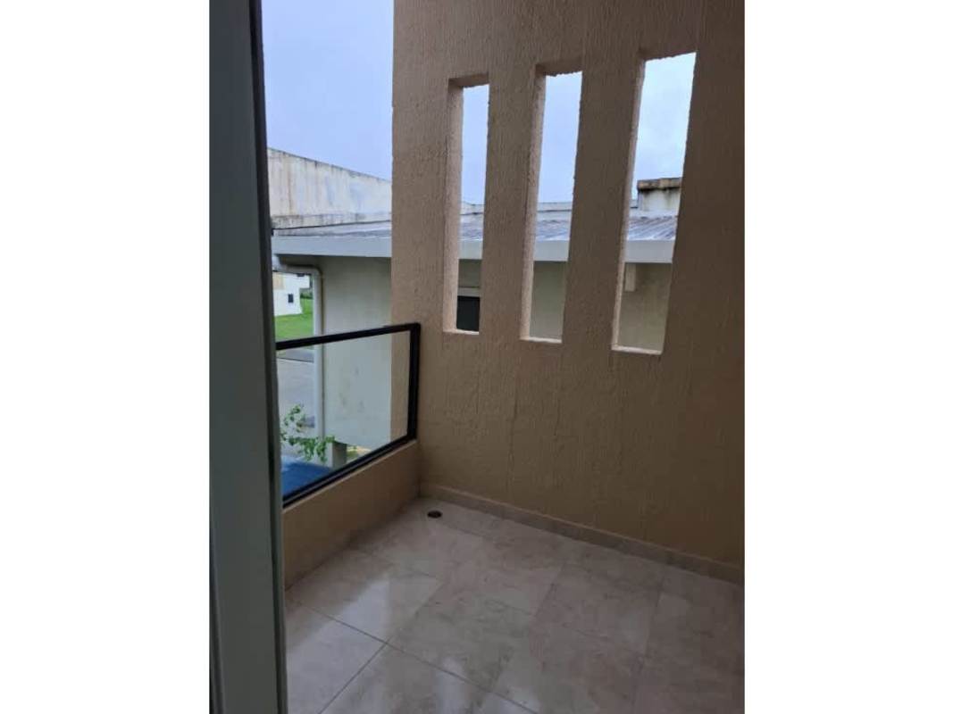 Covered balcony with glass railing and tiled floors in Las Cumbres gated community Panama