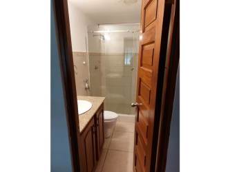 Modern bathroom with glass shower enclosure in house for sale Costa Verde Panama