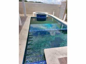 Spacious covered terrace overlooking private garden at Hill Top house Panama