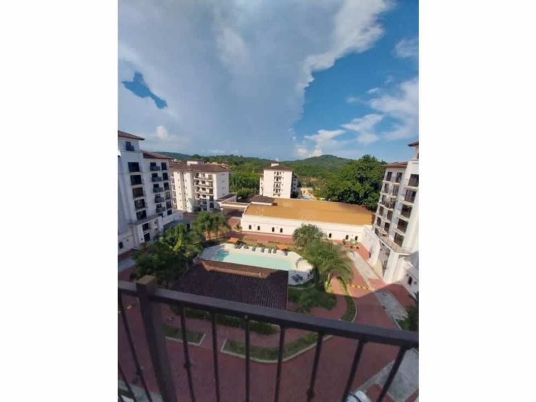 Balcony overlooking tropical courtyard and pool in Embassy Village Clayton Panama