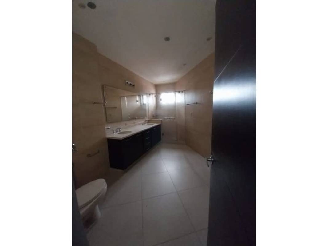 Bathroom with double sink vanity large mirror glass shower PH Embassy Village Panama