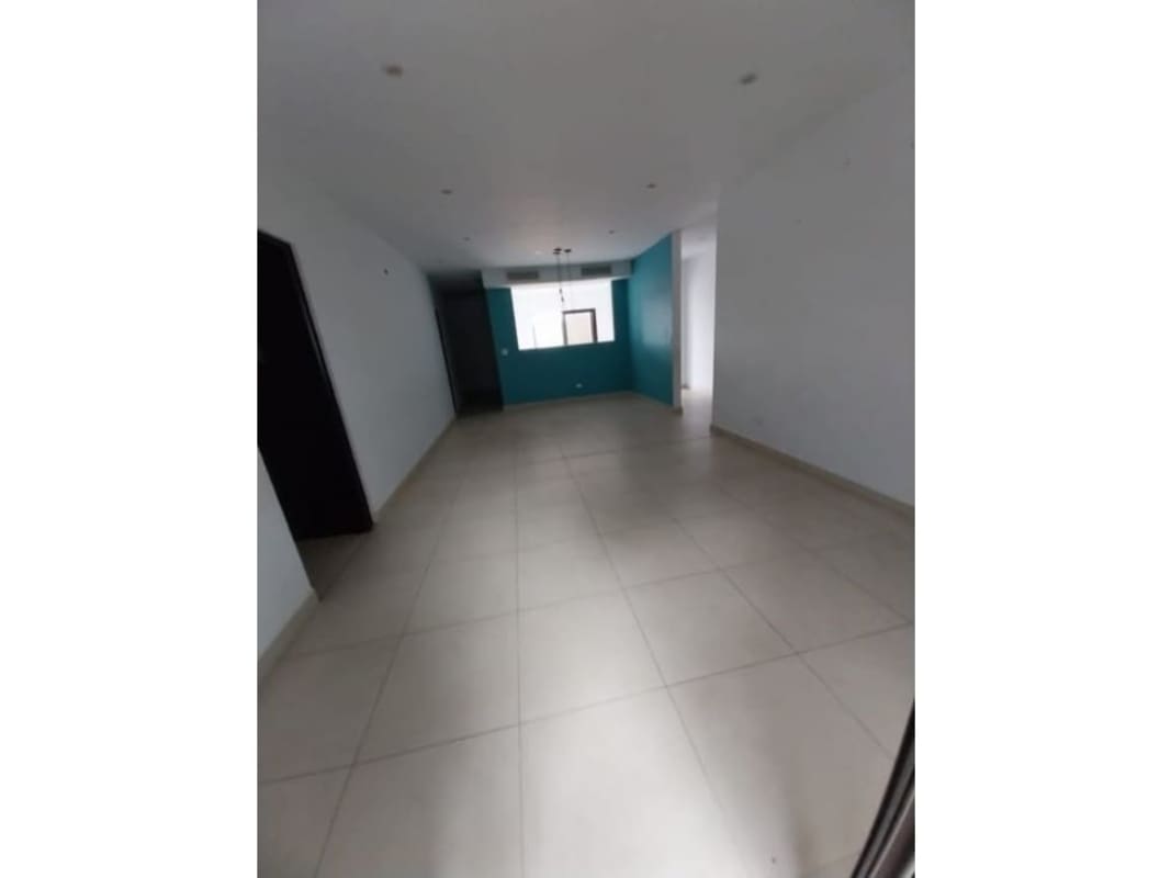 Bedroom with large window tile floors neutral decor Embassy Village Clayton