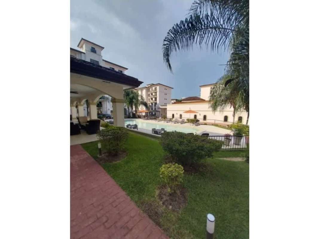 Mediterranean-style condo complex featuring landscaped pool Embassy Village Clayton Panama