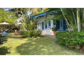 Large covered porch terrace with hammocks and garden in Coronado beach rental Panama