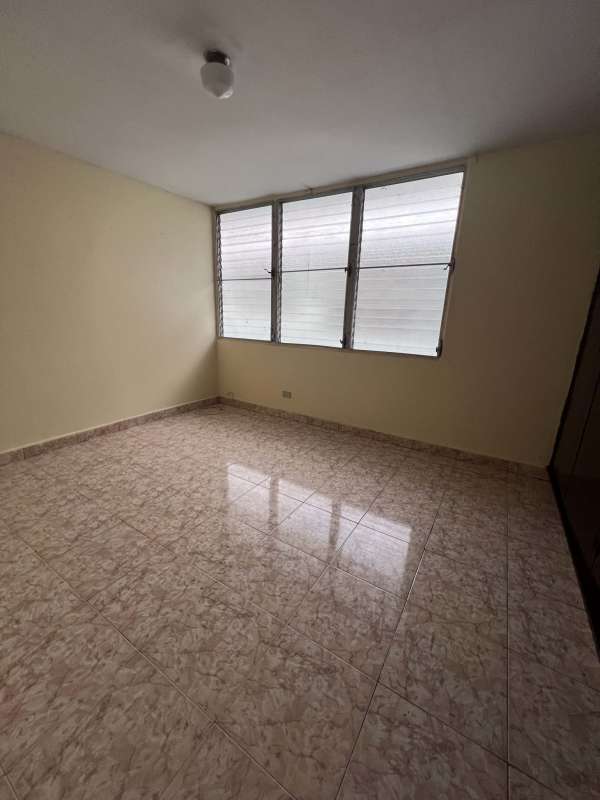 Spacious living area with large windows and balcony Bella Vista apartment Panama City