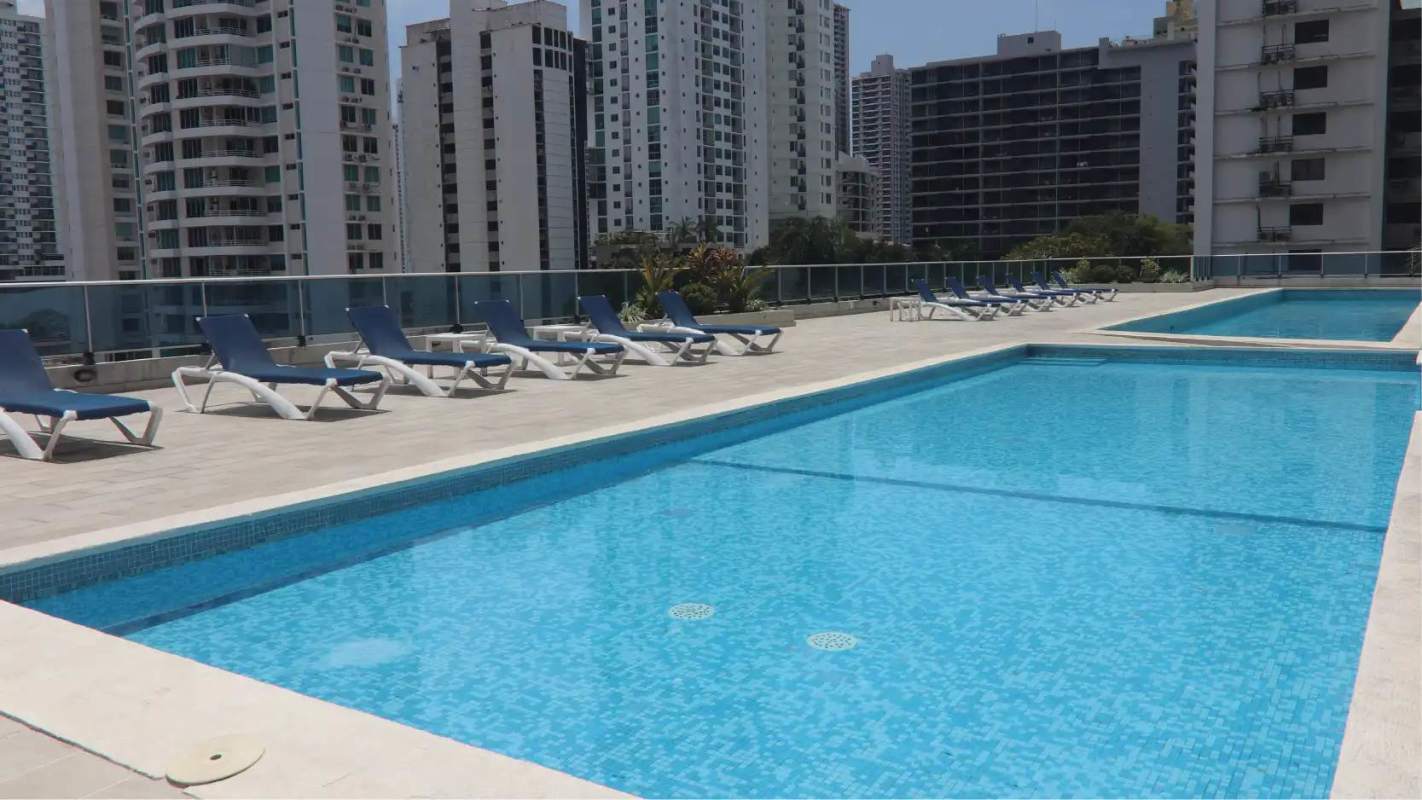Outdoor rooftop infinity pool overlooking skyline of Panama City at PH Harmony Tower