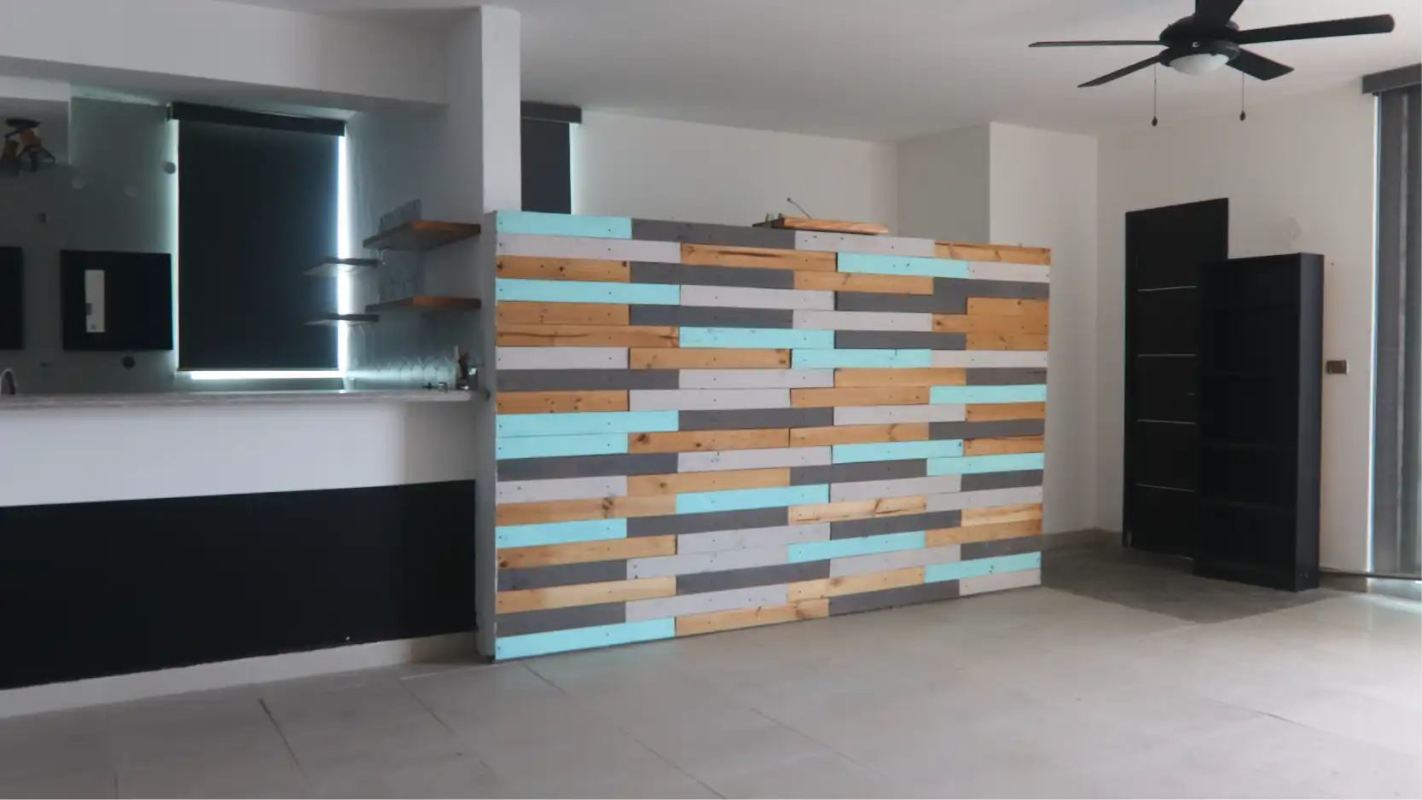 Living space with feature accent wall and open kitchen area in Harmony Tower Panama