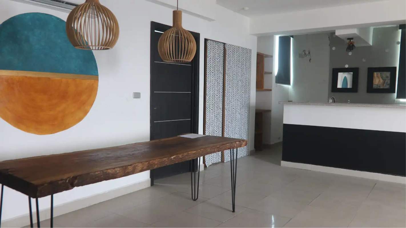 Modern open dining space with kitchen and accent lighting in Harmony Tower Panama