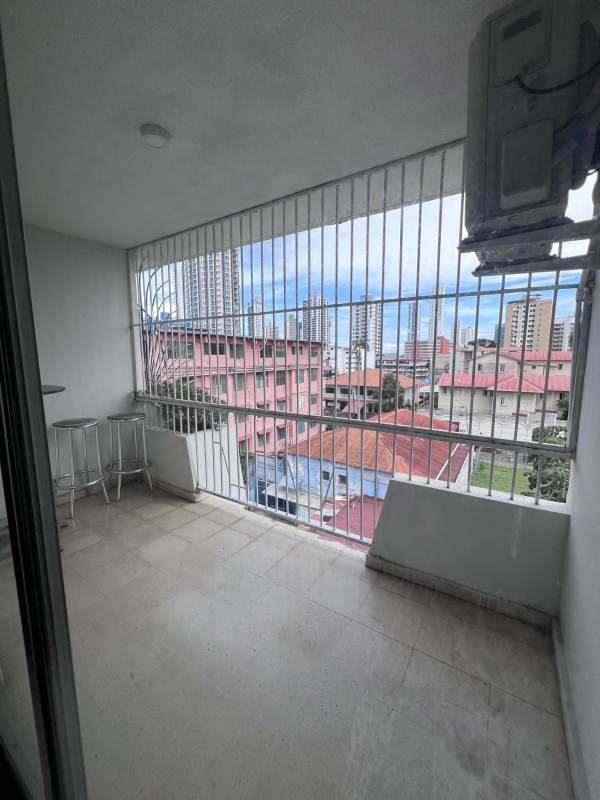 Private balcony with seating and city skyline view in PH Bella Vista Tower Panama City