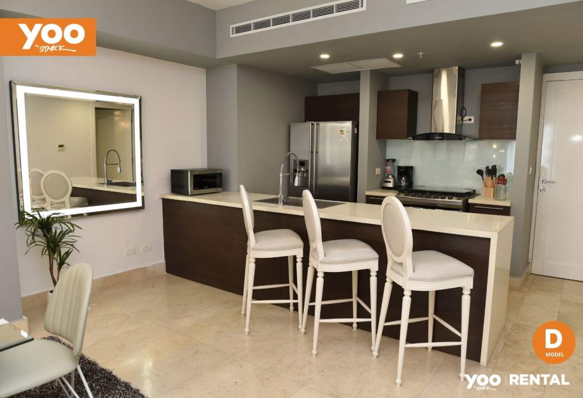 Contemporary kitchen with marble island and stainless steel appliances at PH Yoo Avenida Balboa Panama City
