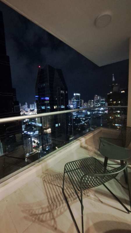 Dining space adjoining living room with ocean views at PH BICSA Panama