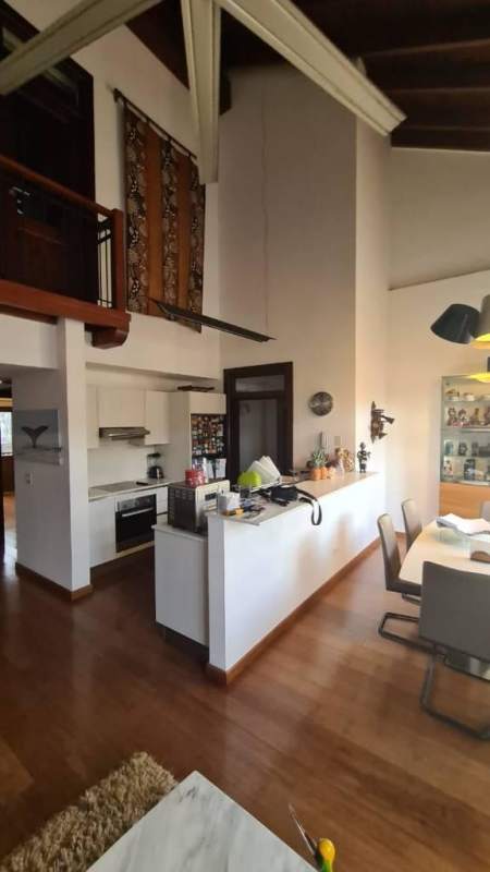 Contemporary kitchen with high ceiling, wood floors, stone details in Casco Viejo Panama