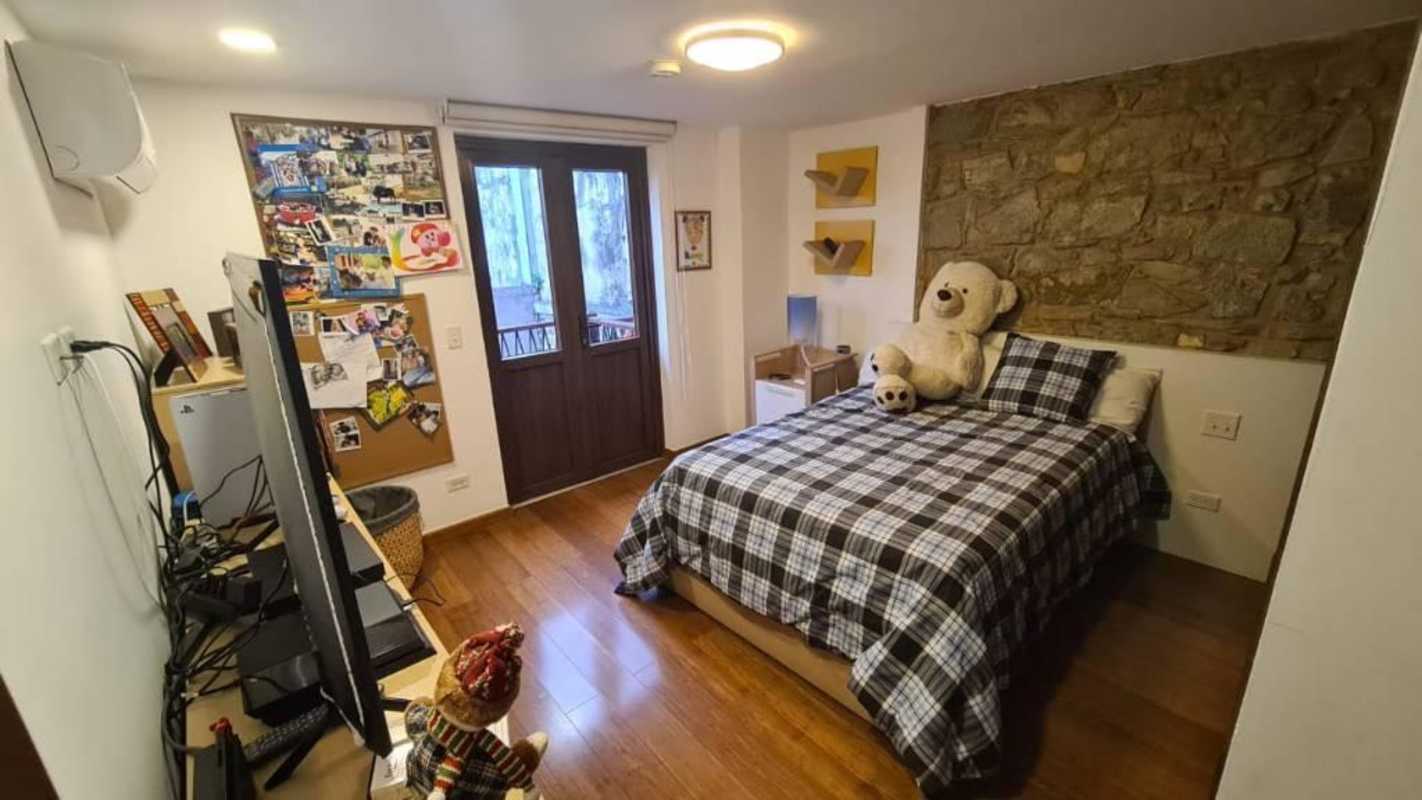 Modern bathroom with vessel sink and glass-enclosed shower in Portal de Caldas Casco Viejo