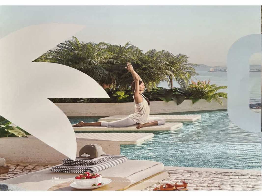 Infinity pool area with lounging space facing ocean at PH Ipanema Costa del Este Panama