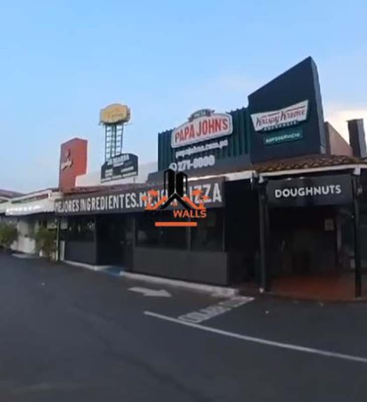 Retail strip with Krispy Kreme Papa John's and other franchises with drive-thru access