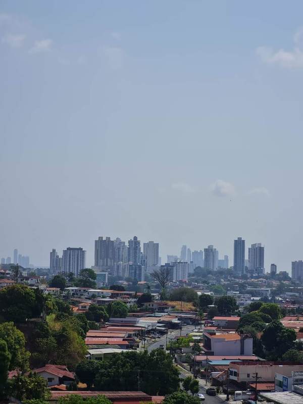 Aerial skyline of Panama City with condos and greenery near Villa de las Fuentes